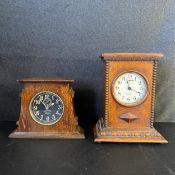 An Ingersoll Radiolite Revally mantle clock with black dial in a shaped oak case along with an