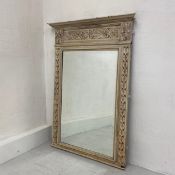 A French 19th century painted pier glass or overmantel mirror having a moulded cornice with a carved
