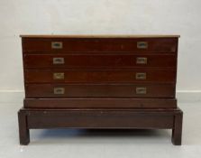 An early 20th century two part plan chest with inset brass handles on stand. 98x145x98cm