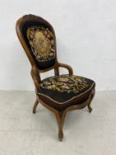 A 19th century carved walnut bedroom chair in it's original tapestry upholstery. H.101cm