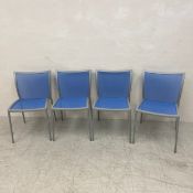 A set of four Zanotta aluminium framed dining chairs with mesh back and seats and maker's stamp to