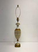 A Sevres style baluster form porcelain table lamp with hand painted decoration on an ormolu base.