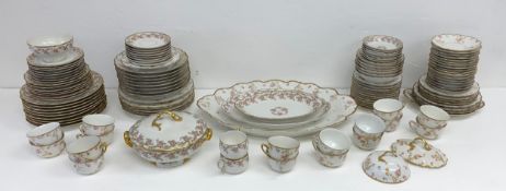 An extensive part dinner service by Limoges Elite Works hand decorated with gilt edging and