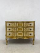 A vintage Florentine gilt and painted three drawer commode chest with all-over scrolling foliate