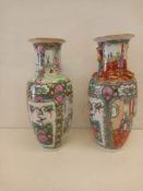 A pair of vintage Canton Famille Rose baluster vases each having bird and blossom decoration and