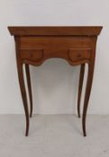 A 19th century French Provincial fruitwood sewing or vanity table with fitted interior on cabriole