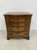 A Georgian style mahogany serpentine fronted bachelor's chest with brushing slide and four long