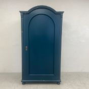 A 19th century painted pine hall cupboard with arched panel door enclosing hanging space. H.193 W.97