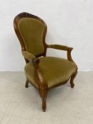 A mid 19th century carved walnut armchair on cabriole supports. H.100cm