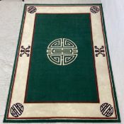 A contemporary Chinese style carpet by Laila De Luxe having a central Shou symbol of longevity