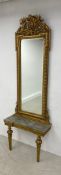 A 19th century giltwood console table having a marble breakfront top and scrolling foliate frieze