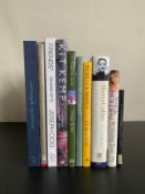A mixed collection of signed and unsigned books.