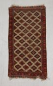 A possibly 19th century Afghan style Baluch rug with allover stepped diamond lozenge pattern over an