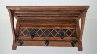 A mid century wall hanging oak coat rack with luggage shelf. H.42 W.84.5 D.31.5cm
