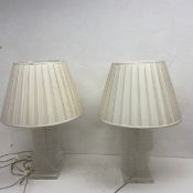 A pair of table lamps with perspex spiral stacked bases. H.75cm (including shade)