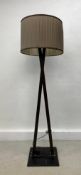 A contemporary floor standing metal framed standard lamp with pleated shade. H.176cm