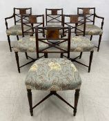 A set of six Regency mahogany dining chairs including two carvers each having a carved and shaped