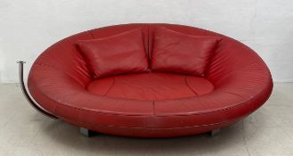 A vintage De Sede DS 152 red leather two seater sofa or loveseat of oval platelet form by Jane