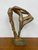 A vintage Art Deco style patinated resin figure titled 'Sultry Awakening' after the original by