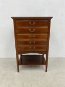 A late 19th century walnut sheet music cabinet of five long drawers each with fall front above