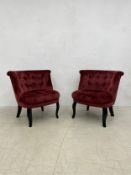 A pair of contemporary salon chairs in buttoned upholstery on ebonised cabriole supports. H.74cm