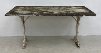 A painted wrought metal garden table with weathered marble top. 72x138x61cm