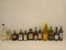 A mixed collection of twelve bottles of spirits and liqueurs to include Absinthe, Kord, Disaronno