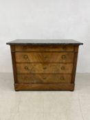 A 19th century Louis Phillippe flame mahogany commode chest of drawers having a rectangular marble