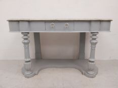 A mid 19th century Duchess style washstand with shaped marble top above later painted base. H.69 W.