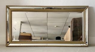 A contemporary Venetian style wall mirror in bevelled glazed frame. 74x149cm