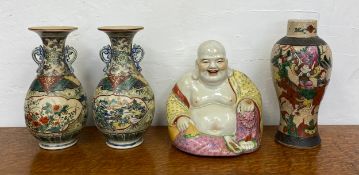 A pair of Chinese twin handled vases of baluster form (one with damage as seen), a Buddha figure and