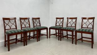 A set of six vintage Regency style mahogany dining chairs each having a shaped and crossbanded