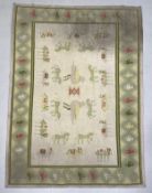 A large 20th century Indian flat-weave Dhurrie carpet having a central figural pattern in concentric