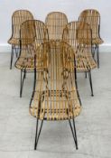 A set of six metal framed dining chairs with caned backs and seats. H.78cm