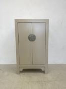 A contemporary Chinese lacquered hardwood cabinet. 120x70x39cm