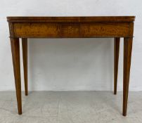 A George III satinwood and rosewood crossbanded fold-over top card table with satinwood foliate