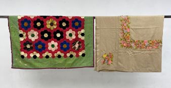 A C.1900 silk patchwork quilt along with a 20th century hand embroidered 'convent' tablecloth from