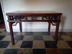 A C.1900 Chinese hardwood side or centre table with carved foliate freeze on circular section