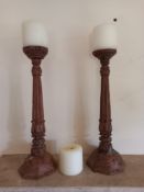 A pair of carved ecclesiastic style pricket candlesticks. H.37cm. ** Please note this item can be