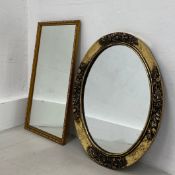 A contemporary rectangular wall mirror in a scrolling gilt frame along with a circular mirror in a