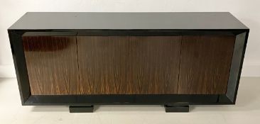 A four-door sideboard by luxury British furniture designer Davidson’s of London. The Macassar ebony