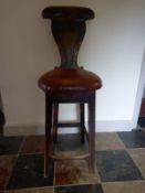 A 19th century beech high stool with lyre back. H.112cm. ** Please note this item can be viewed at
