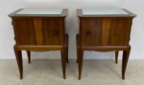 A pair of Continental Art Deco bedside cabinets with inset mirrored tops raised on slender