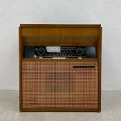 A mid-century French teak console radio and record player by His Master's Voice having a rectangular