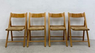 A set of four mid-century folding A-frame chairs each having a curved back over a rush seat raised