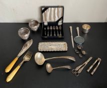 An English hallmarked silver letter opener and magnifying glass and a similar miniature tea and
