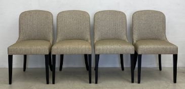 Four contemporary dining chairs each having a shaped back and calico upholstered stuff-over seat