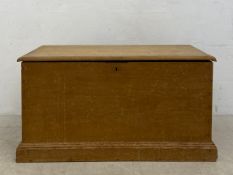 A C.1900 pine chest or coffer having a rectangular top and carcass with iron hinges and carrying