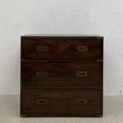 A vintage mahogany and brass bound campaign style chest of three long graduating drawers. H.70 W.