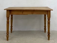 A C.1900 pine kitchen dining table having a rectangular top over a single frieze drawer raised on